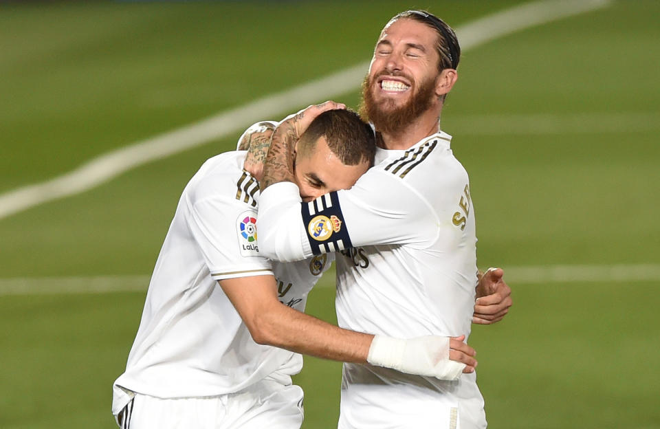 MADRID, SPAIN - JULY 16: Karim Benzema of Real Madrid celebrates with Sergio Ramos after he scored the second goal from a penalty during the Liga match between Real Madrid CF and Villarreal CF at Estadio Alfredo Di Stefano on July 16, 2020 in Madrid, Spain. (Photo by Denis Doyle/Getty Images)