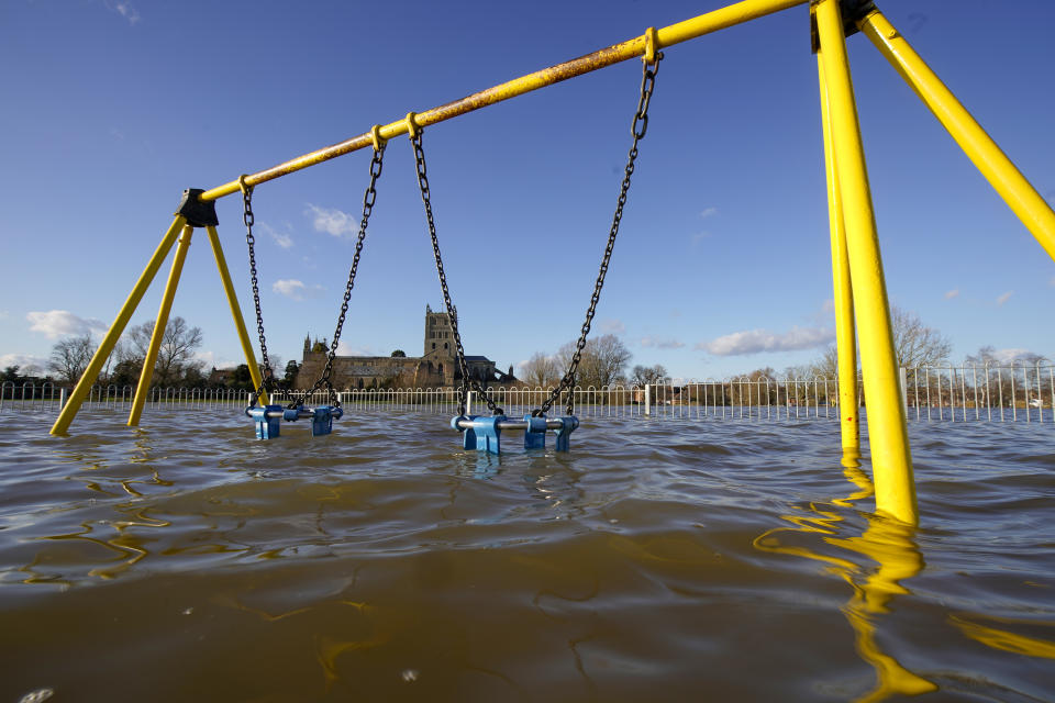 TEWKESBURY, ENGLAND - FEBRUARY 27:  Tewkesbury Abbey and a children's playground at the confluence of the Rivers Severn and Avon, is surrounded by flood waters on February 27, 2020 in Tewskesbury, England. Flooding levels are decreasing after storms Ciara and Dennis, however forecasters are predicting more rain and 70mph winds this weekend from storm Jorge. (Photo by Christopher Furlong/Getty Images)