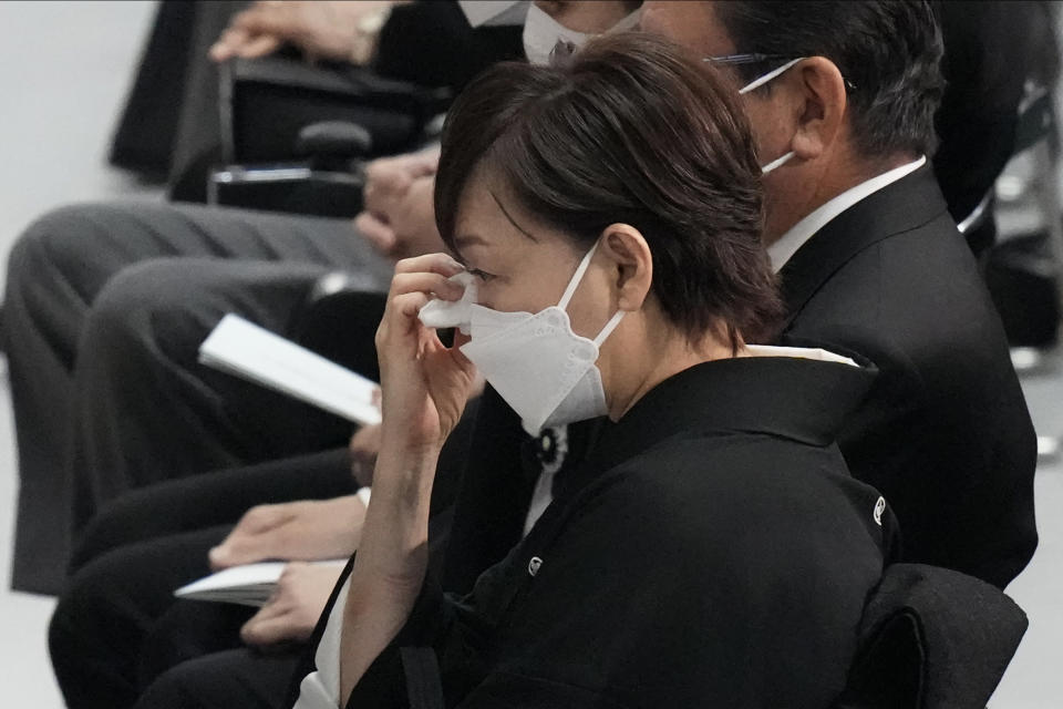 Akie Abe, widow of former Prime Minister of Japan Shinzo Abe, wipes away tears during the state funeral of her husband Tuesday Sept. 27, 2022, at Nippon Budokan in Tokyo. (AP Photo/Eugene Hoshiko, Pool) ///