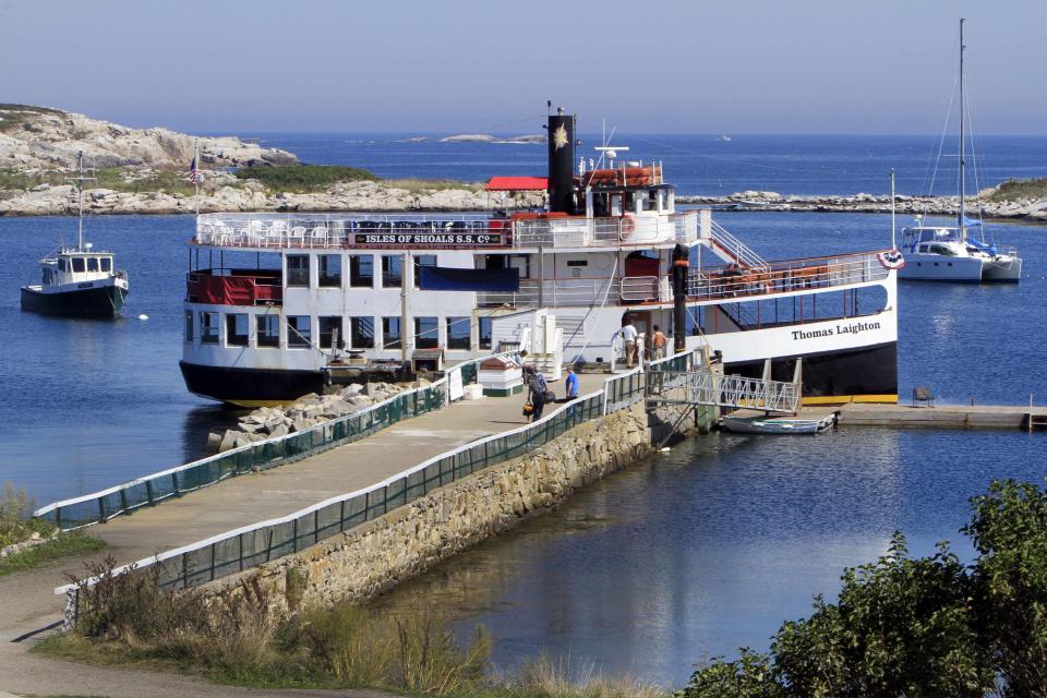 In this photo taken Friday, Sept. 14, 2012, the passenger carrier Thomas Laighton sits in harbor at the historic Star Island Family Retreat and Conference Center at the Isle of Shoals in Rye, N.H. The hotel 10 miles off the coast of New Hampshire wants to establish itself as an environmental leader. The island is essentially a self-contained system, and it is an ideal spot to showcase energy innovations and could be become a model for other communities. (AP Photo/Jim Cole)