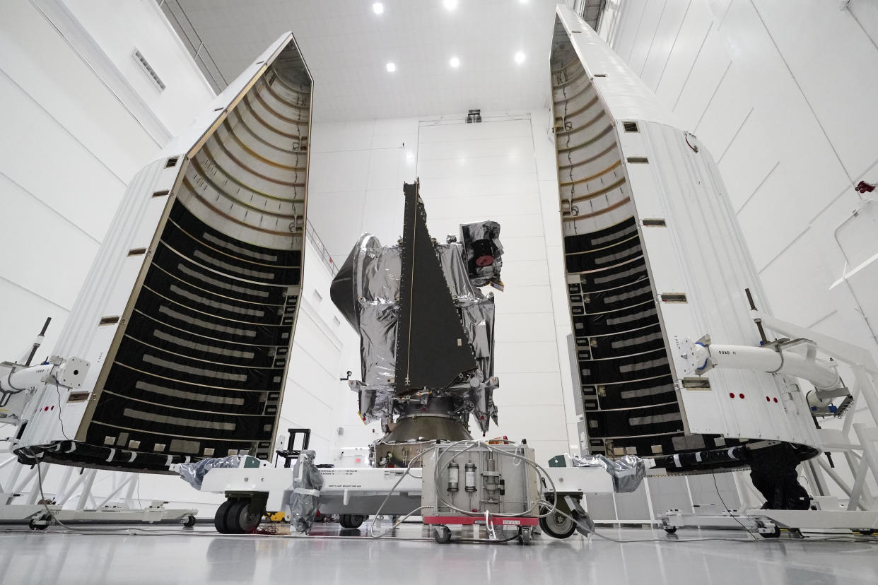 FILE - This Wednesday, Sept. 29, 2021 file photo shows NASA's Lucy spacecraft with its housing at the AstroTech facility in Titusville, Fla. It will be first space mission to explore a diverse population of small bodies known as the Jupiter Trojan asteroids. (AP Photo/John Raoux, File)