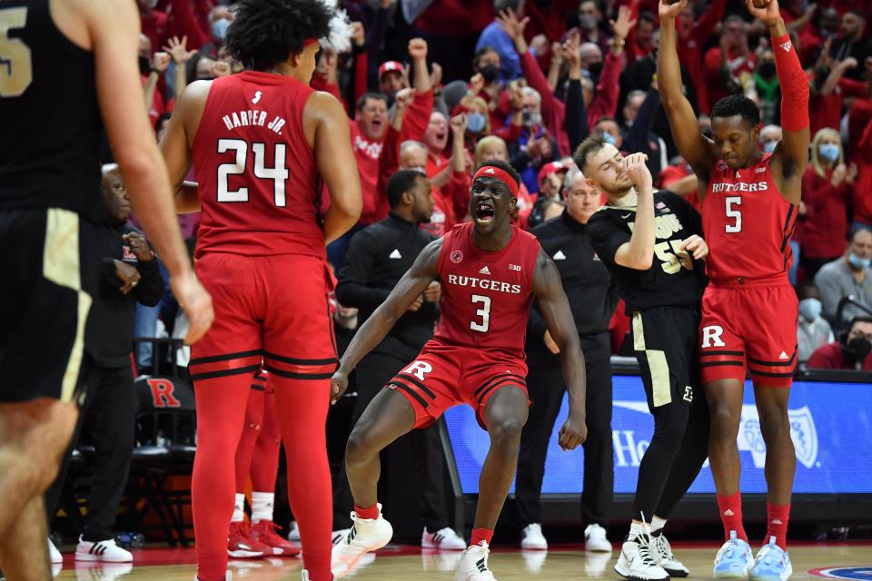 Dec 9, 2021; Piscataway, New Jersey, USA; Rutgers Scarlet Knights forward Mawot Mag (3) reacts with teammates after gaining possession back against the Purdue Boilermakers during the second half at Jersey Mike's Arena. Mandatory Credit: Catalina Fragoso-USA TODAY Sports