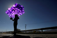 <p>An activist holds purple balloons at El Navajo creek, where the bodies of several women were found, during a ceremony to mark the International Day for the Elimination of Violence Against Women in Praxedis G. Guerrero, on the outskirts of Ciudad Juarez, Mexico, Nov. 24, 2017. (Photo: Jose Luis Gonzalez/Reuters) </p>