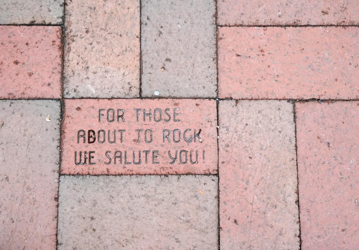 Jan. 31, 2024; Columbus, Ohio, USA; 
A brick in front of the CD 92.9 FM building proclaims, "For those about to rock, we salute you!"