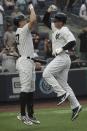 New York Yankees' Anthony Rizzo, right, bumps fists with teammate Giancarlo Stanton after his home run during the first inning of a baseball game against the Oakland Athletics, Monday, June 27, 2022, in New York. (AP Photo/Bebeto Matthews)