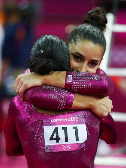 Aly Raisman, right, embraces Gabby Douglas, who won the all-around gold medal. (Reuters)