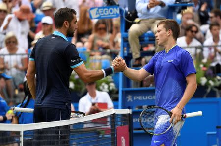 Tennis - Aegon Championships - Queen’s Club, London, Britain - June 22, 2017 Croatia's Marin Cilic shakes hands with USA's Stefan Kozlov after winning their second round match Action Images via Reuters/Tony O'Brien