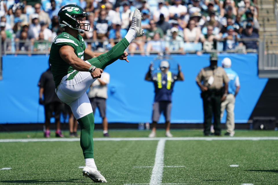 New York Jets kicker Matt Ammendola punts against the Carolina Panthers during the first half of an NFL football game Sunday, Sept. 12, 2021, in Charlotte, N.C. Punter Braden Mann sprained his left knee during his first punt and the Jets had to turn to Ammendola to handle the punting duties. (AP Photo/Jacob Kupferman)