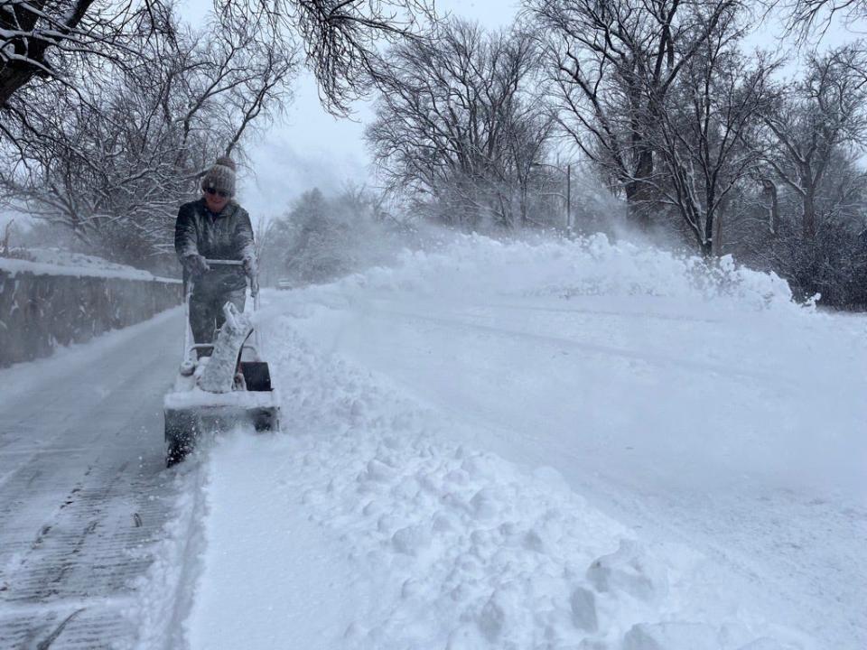 A city of Fort Collins employee blows snow at City Park on Wednesday, Jan. 18. 2023.