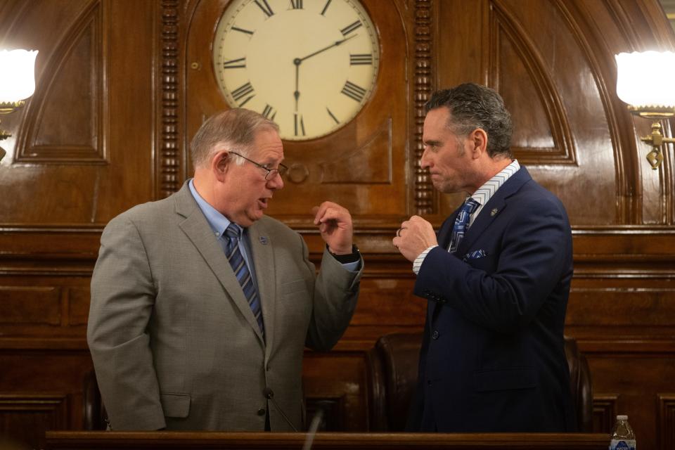 Speaker of the House Rep. Dan Hawkins, R-Wichita, exchanges words with Senate President Ty Masterson, R-Andover, before the start of Wednesday's State of the State address.