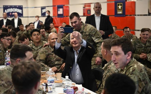 US President Joe Biden takes a selfie with service members from the 82nd Airborne Division, who are contributing alongside Polish Allies on the Alliances Eastern Flank, in the city of Rzeszow in southeastern Poland, around 100 kilometres (62 miles) from the border with Ukraine, on March 25, 2022.&#xa0; - Brendan Smialowski/AFP