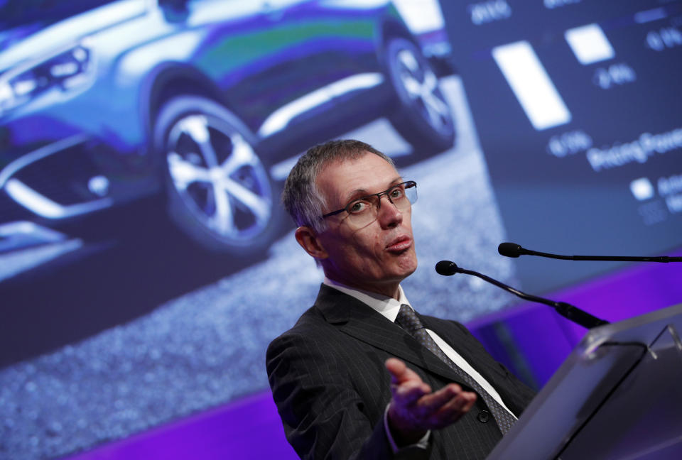 PSA Peugeot Citroen Chief Executive Carlos Tavares delivers his speech during the presentation of the company's 2016 full year results, in Paris, Thursday, Feb.23, 2017. French carmaker PSA Group saw its profits jump last year and is giving dividends for the first time since 2011, burnishing its image as it weighs a buyout of General Motors' money-losing European operations. (AP Photo/Christophe Ena)