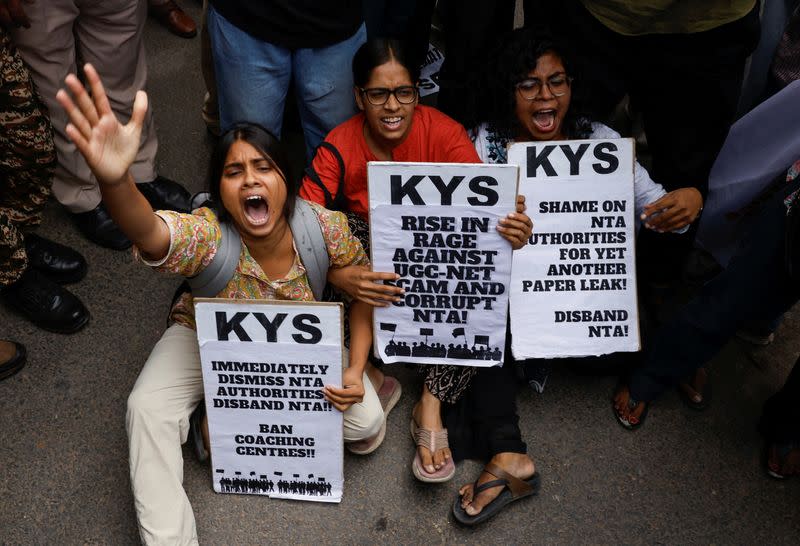 Students holding placards protest outside the Ministry of Education against the cancellation of the UGC-NET examination at New Delhi