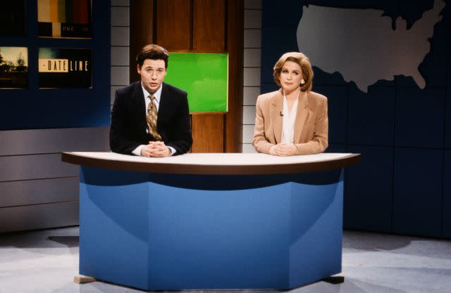 <p>Al Levine/NBCU Photo Bank/NBCUniversal via Getty</p> Mike Myers as Stone Phillips, Julia Sweeney as Jane Pauley during the 'Dateline NBC' skit on February 13, 1983 on 'Saturday Night Live'