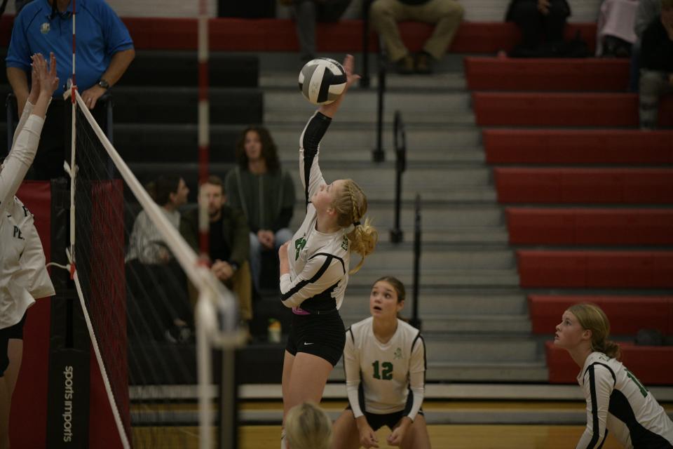 Clear Fork's Bailey McKee sends down a spike during the Colts' five-set thrilling win over Perkins on Tuesday night.