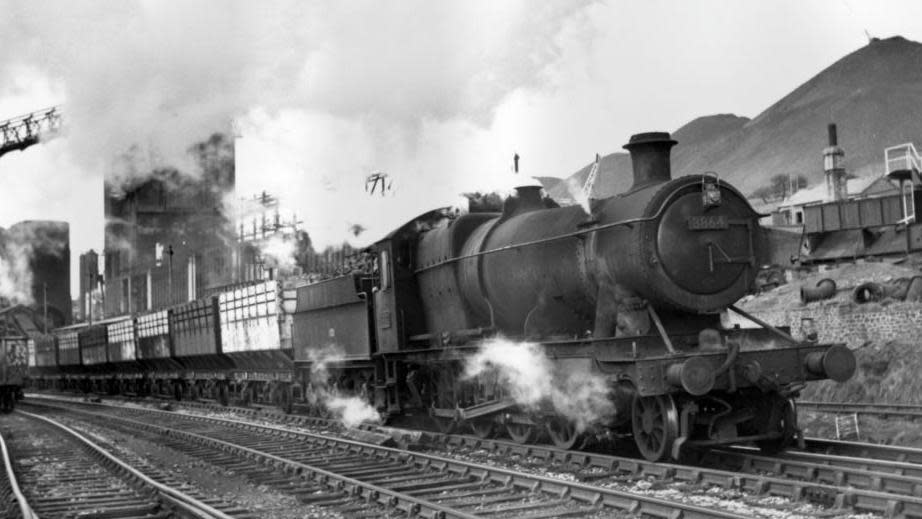 A steam train steams down the line in south Wales