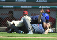 Chicago Cubs security (top) tackles a fan who ran on the field during the sixth inningon September 6, 2015 at Wrigley Field in Chicago, Illinois. (Photo by David Banks/Getty Images)