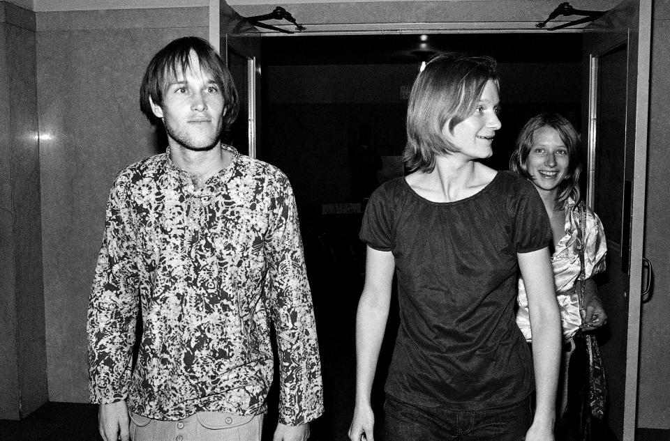 Mary Brunner, center, arrives at the trial of Charles Manson and three others on charges of murdering seven persons July 24, 1970, in Los Angeles.