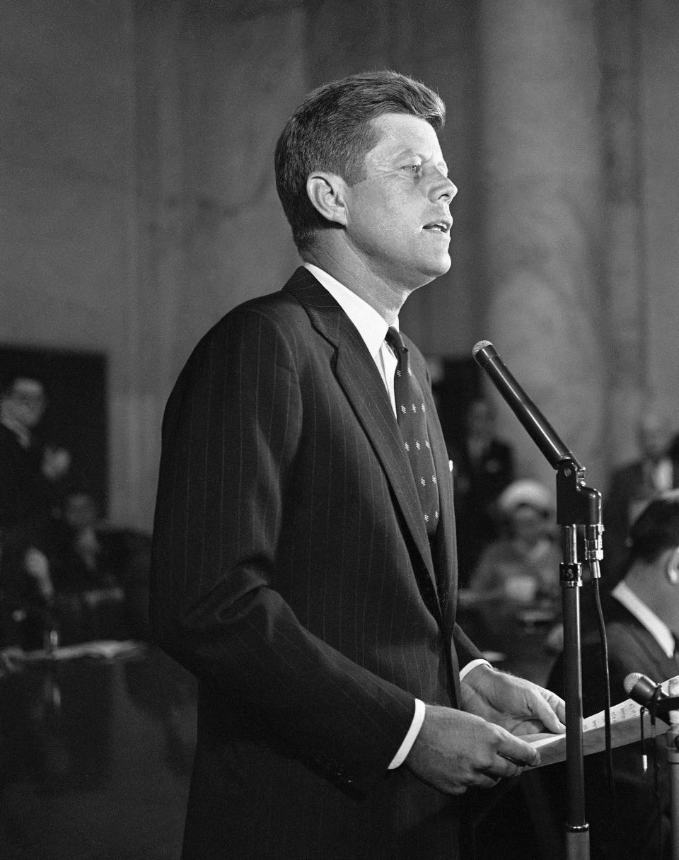 FILE - In this Jan. 2, 1960, file photo, Sen. John F. Kennedy, D-Mass., formally announces at a news conference in Washington that he is a candidate for the Democratic presidential nomination. A handwritten draft Kennedy's announcement speech is among hundreds of items associated with the late president to be auctioned in January 2020, by the Boston-based RR Auction. Online bidding for the collection put together by a California man opens Jan. 17. (AP Photo, File)