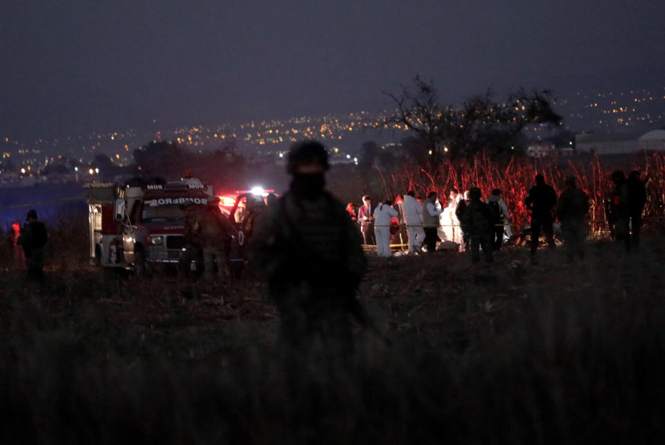 Emergency rescue personnel, the army and the police arrive to the scene of a helicopter crash where Puebla Gov. Martha Erika Alonso and her husband Rafael Moreno Valle, a former Puebla governor, died near Puebla City, southeast of Mexico City on Monday, Dec. 24, 2018. The husband-and-wife political power couple died Christmas Eve in the crash, Mexican officials reported. (AP Photo/Pablo Spencer)