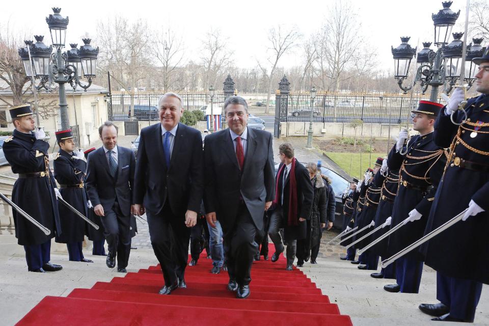 In this Saturday, Jan. 28, 2017 photo, released by the French Foreign ministry, French foreign minister Jean-Marc Ayrault, left, greets his newly appointed German counterpart, Sigmar Gabriel, before talks at the French Foreign Ministry in Paris, France. (Frederic de la Mure/French Foreign Ministry via AP)