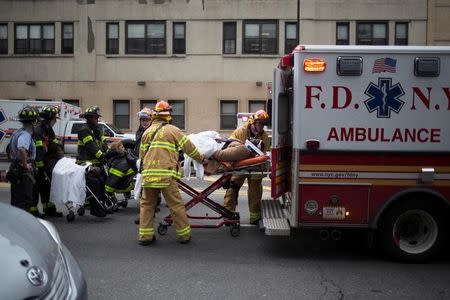 People are transported after a commuter train derailed at Atlantic Terminal in Brooklyn, New York City, U.S., January 4, 2017. REUTERS/Alex Wroblewski