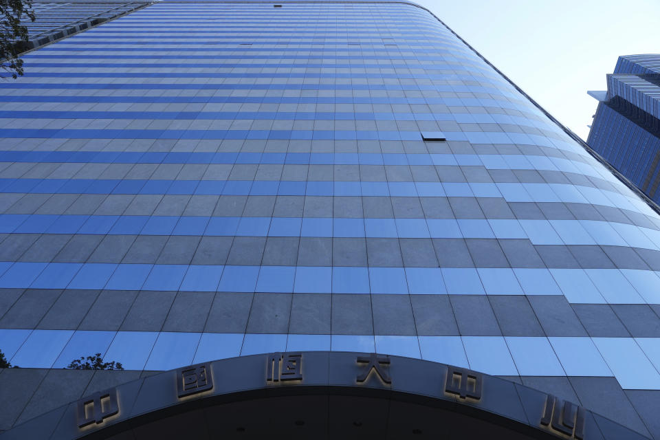 The headquarters of China Evergrande Group is seen in Hong Kong Monday, Oct. 4, 2021. Shares in troubled real estate developer China Evergrande Group and its property management unit Evergrande Property Services were suspended from trading Monday in Hong Kong. (AP Photo/Vincent Yu)