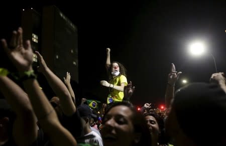 Demontrators take part in a protest against President Dilma Rousseff's appointment of former President Luiz Inacio Lula da Silva as her chief of staff, in front of the Brazilian national congress in Brasilia, Brazil, March 17, 2016. REUTERS/Ricardo Moraes