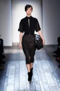 <b>Victoria Beckham AW13 at New York Fashion Week </b><br><br>Victoria's t-shirts featured cut-out detail slashed to the navel, teamed with chic pencil skirts.<br><br>Image © Getty