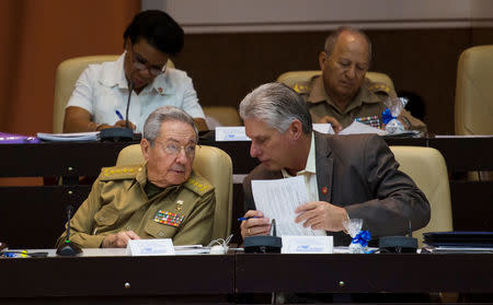 Cuba's President Raul Castro (L) chats with Cuba's First Vice-President Miguel Diaz-Canel during the National Assembly in Havana, Cuba, December 21, 2017. Irene Perez/Courtesy of Cubadebate/Handout via Reuters