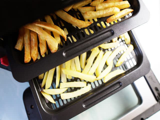 <p>Serious Eats / Riddley Gemperlein-Schirm</p> The multi-layer, tray air fryer we tested made horribly unevenly cooked fries.