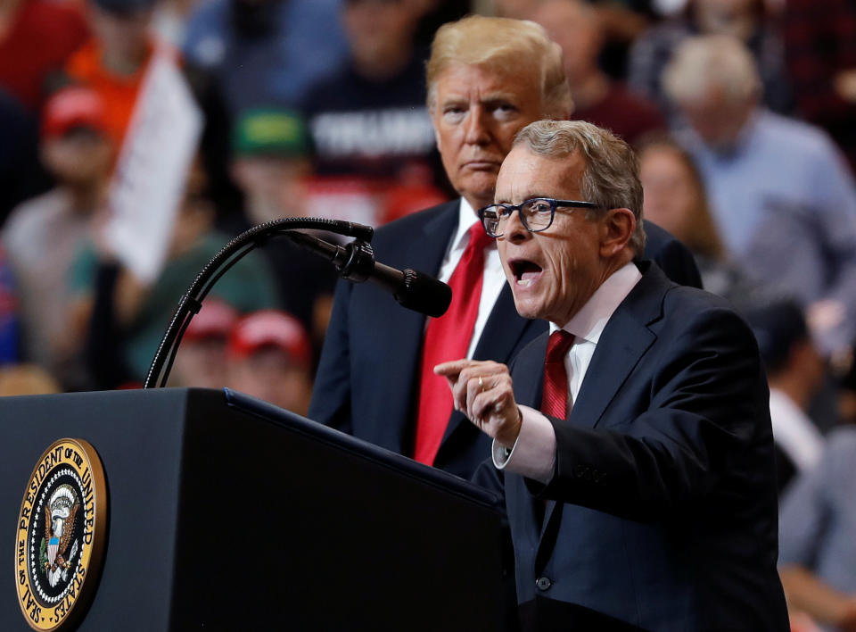 President Donald Trump listens as then Ohio gubernatorial nominee and Ohio Attorney General Mike Dewine speaks during a campaign rally in Cleveland, Ohio in 2018. (Carlos Barria/Reuters)