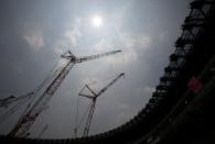 Construction site of the New National Stadium, the main stadium of Tokyo 2020 Olympics and Paralympics, is seen under the light of the sun during a heat wave in Tokyo, Japan July 18, 2018. REUTERS/Issei Kato