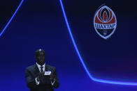 Ivorian coach and former player Yaya Toure shows the name of FC Shakhtar Donetsk during the soccer Champions League draw in Istanbul, Turkey, Thursday, Aug. 25, 2022. (AP Photo/Emrah Gurel)