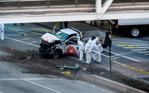 Investigators inspect a truck following a shooting incident in New York on October 31, 2017 - Credit: AFP PHOTO / Don EMMERTDON EMMERT/AFP/Getty Images