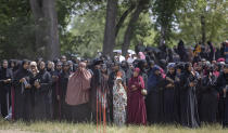 Crowds of women and men attend the funeral of the five people killed in a car crash on Lake Street, at the Garden of Eden Islamic Cemetery in Burnsville, Minn., on Monday, June 19, 2023. (Elizabeth Flores/Star Tribune via AP)