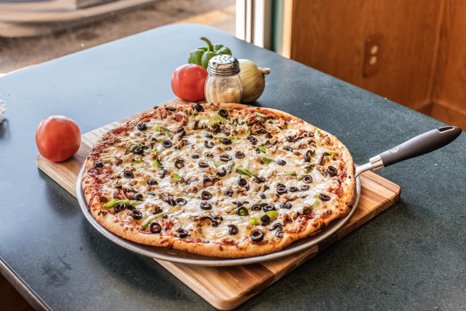 Bellacino’s Pride Pizza is similar to a supreme, loaded with meats and vegetables