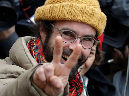 Cedric Herrou, a French farmer and volunteer helping migrants cross French-Italian border to avoid police controls, reacts after he was handed a 3,000 euros ($3,192) suspended fine for his actions at the courthouse in Nice, France, February 10, 2017. REUTERS/Eric Gaillard