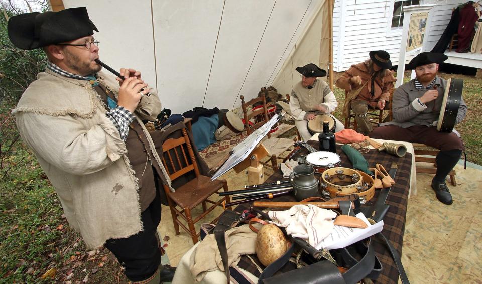 Matthew Waisner and the rest of the Carolina Thunder Mugs play traditional holiday music during the Spirit of Christmas Past event held Saturday, Dec. 3, 2022, at the Kings Mountain Historical Museum.