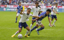 United States Sergino Dest, left, and Japan's Daichi Kamada fight for the ball during the international friendly soccer match between USA and Japan as part of the Kirin Challenge Cup in Duesseldorf, Germany, Friday, Sept. 23, 2022. (AP Photo/Martin Meissner)