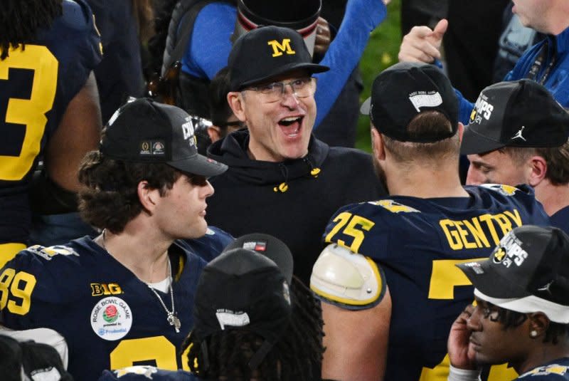 The Los Angeles Chargers agreed to hire Michigan's Jim Harbaugh (C) as their head coach. File Photo by Jon SooHoo/UPI