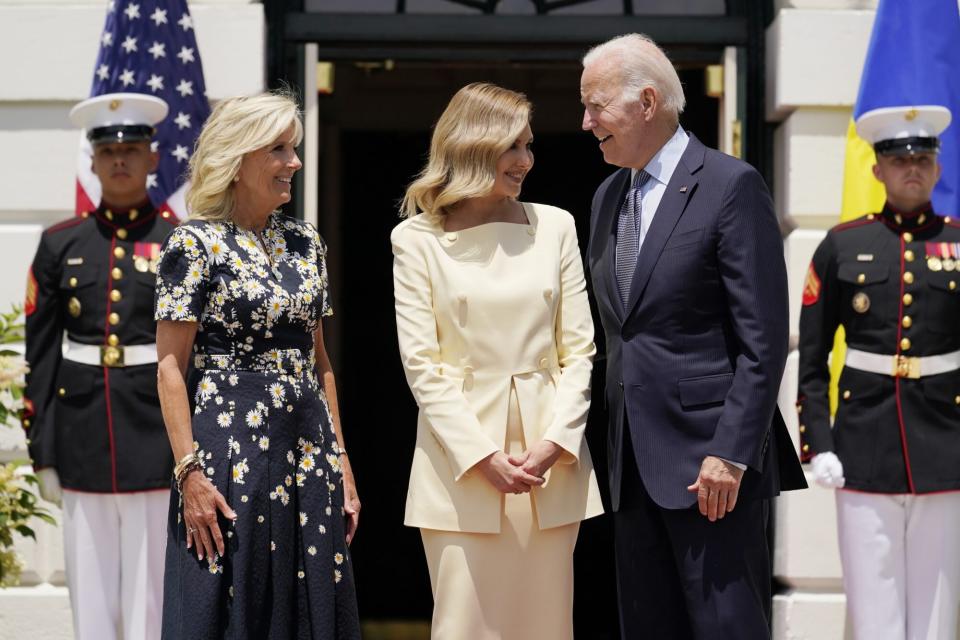 President Joe Biden and first lady Jill Biden, greet Olena Zelenska, spouse of Ukrainian's President Volodymyr Zelenskyy and Ukraine's Ambassador to the United States, Oksana Markarova, left, at the White House in Washington, Tuesday, Jan. 19, 2022. (AP Photo/Andrew Harnik)