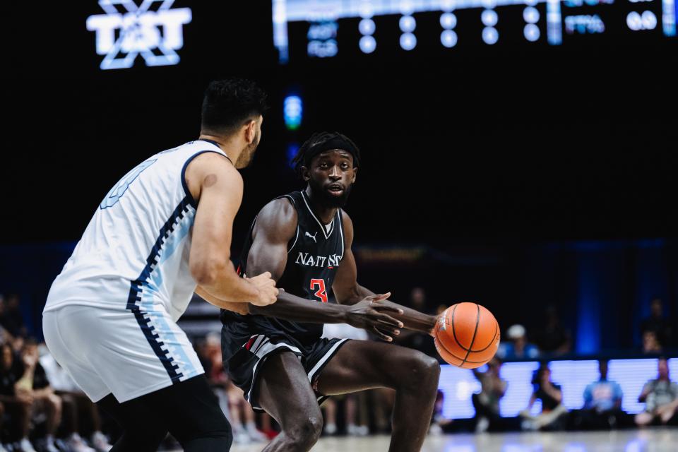 Mamoudou Diarra dribbles against former Xavier player Kerem Kanter. Diarra's Nasty 'Nati team defeated Zip'Em Up 77-73 in TBT play at Xavier to advance to Monday's regional championship at Cintas Center.