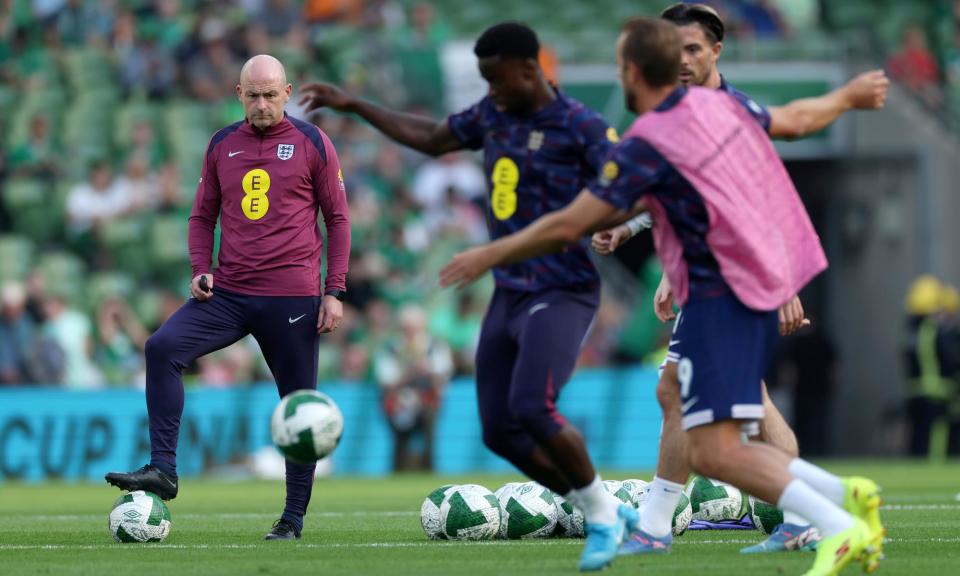 <span>Lee Carsley looks on as England warm up at the Aviva Stadium before the 2-0 win over the Republic of Ireland.</span><span>Photograph: Eddie Keogh/The FA/Getty Images</span>