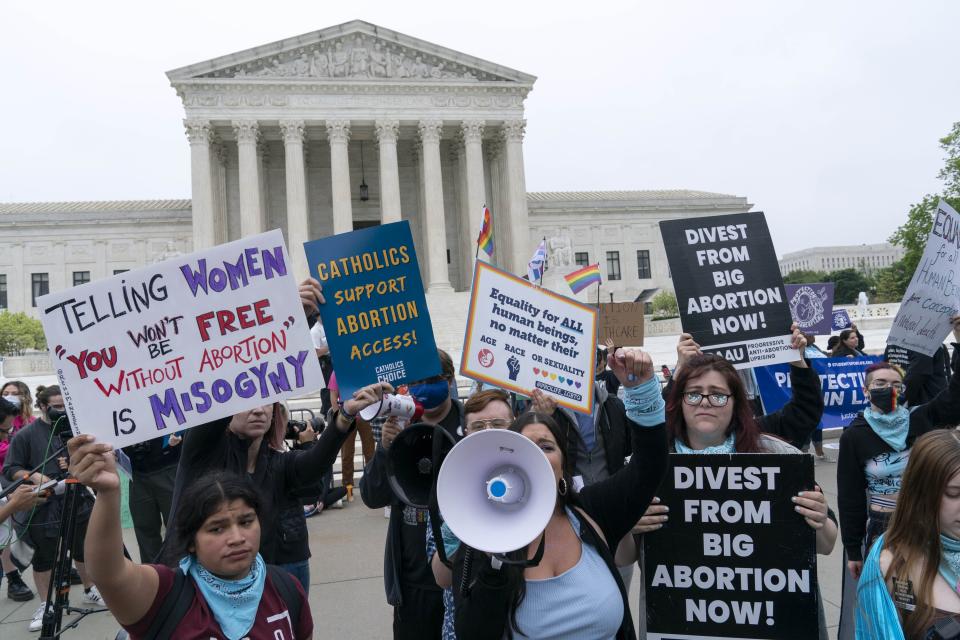 Demonstrators protest outside of the U.S. Supreme Court Tuesday, May 3, 2022 in Washington. A draft opinion suggests the U.S. Supreme Court could be poised to overturn the landmark 1973 Roe v. Wade case that legalized abortion nationwide, according to a Politico report released Monday. Whatever the outcome, the Politico report represents an extremely rare breach of the court's secretive deliberation process, and on a case of surpassing importance.