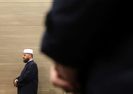 The Basic Court of Pristina delivers a verdict against the imam of the grand mosque Shefqet Krasniqi (L), who was indicted of influencing young Kosovars into joining radical Islamic groups through his lectures, in Pristina, Kosovo March 23, 2018. REUTERS/Hazir Reka