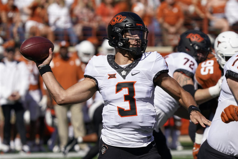 Oklahoma State quarterback Spencer Sanders (3) looks to pass against Texas during the first half of an NCAA college football game in Austin, Texas, Saturday, Oct. 16, 2021. (AP Photo/Chuck Burton)
