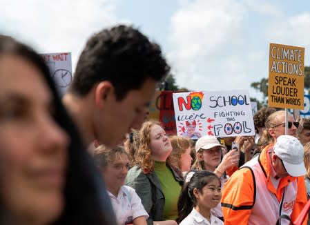 People take part in a protest to call for action on climate change in Sydney