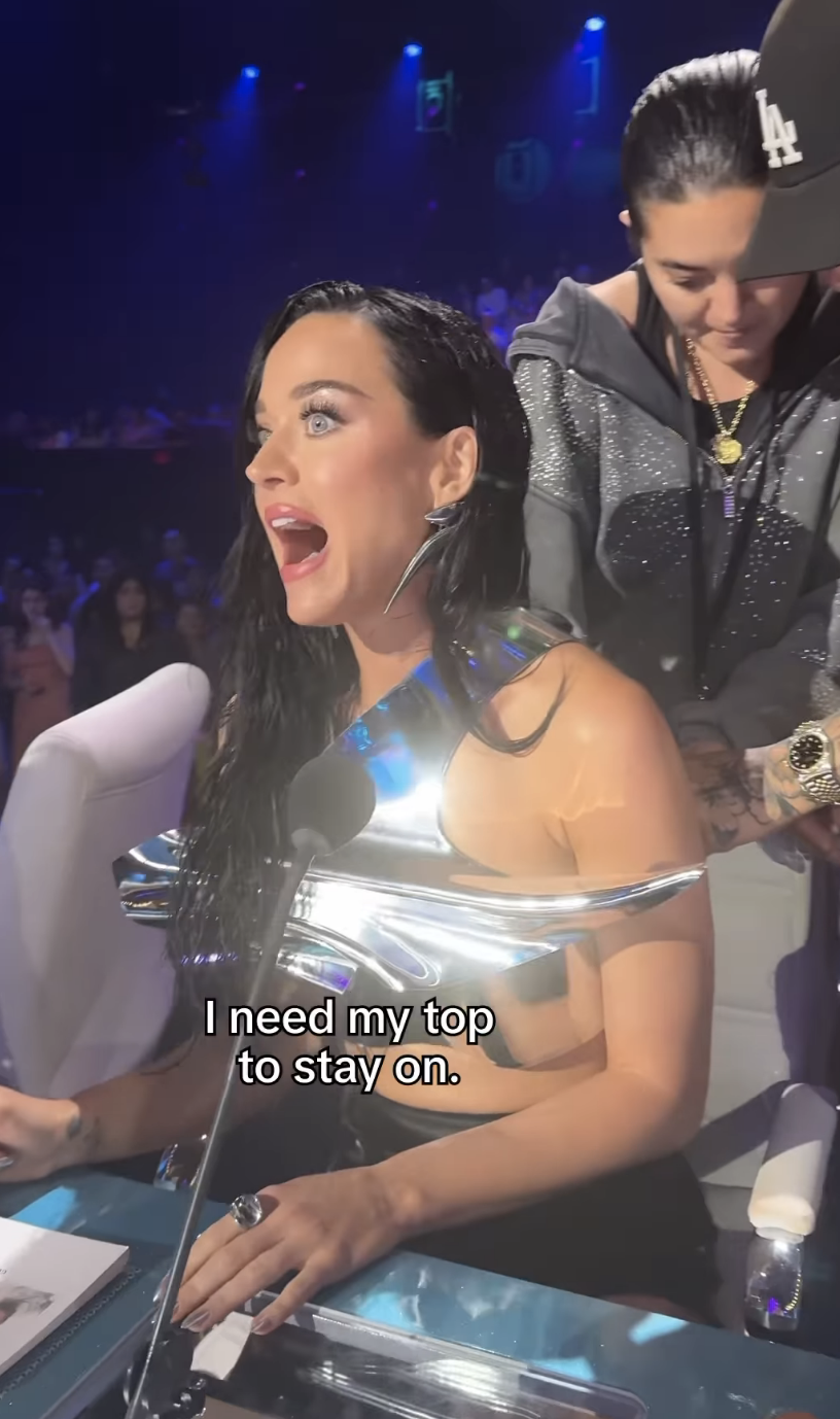Katy Perry saying, "I need my top to stay on."