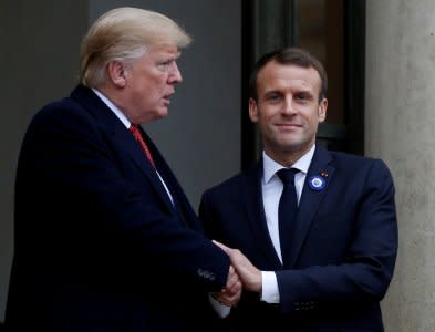 FILE PHOTO: French President Emmanuel Macron shakes hands with U.S. President Donald Trump after a meeting at the Elysee Palace on the eve of the commemoration ceremony for Armistice Day, 100 years after the end of the First World War, in Paris, France, November 10, 2018.  REUTERS/Vincent Kessler/File Photo